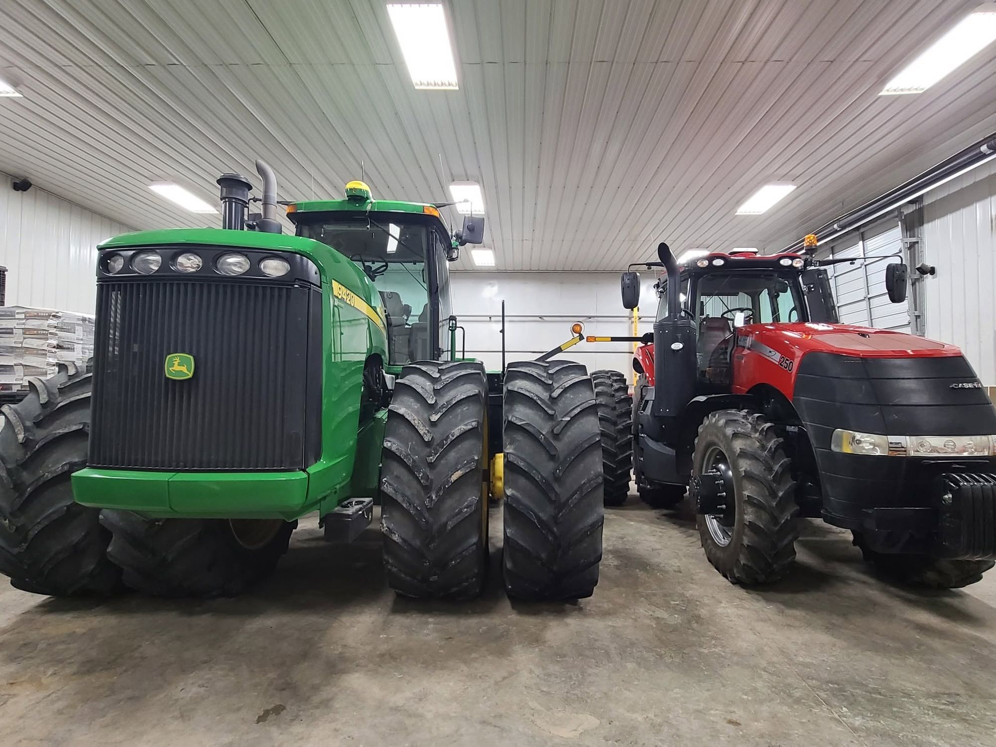 A John Deere 9420 and a Case IH Magnum 250 tractor side by side after detailing